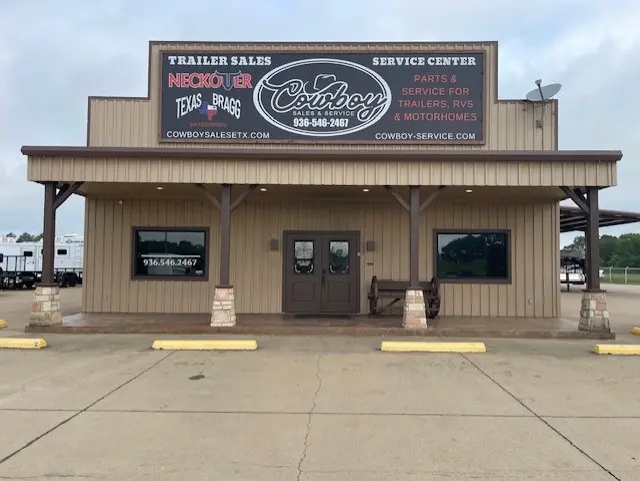 Exterior of a rustic building housing a motorcycle sales and service center.